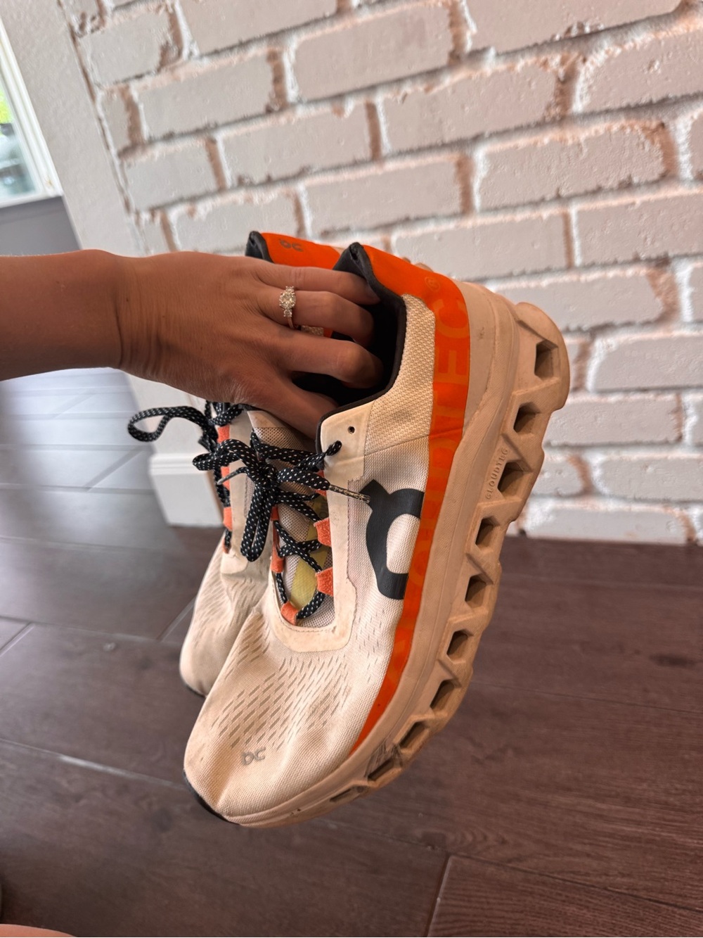 On Running Men’s White and Orange Cloudmonster Running Shoes